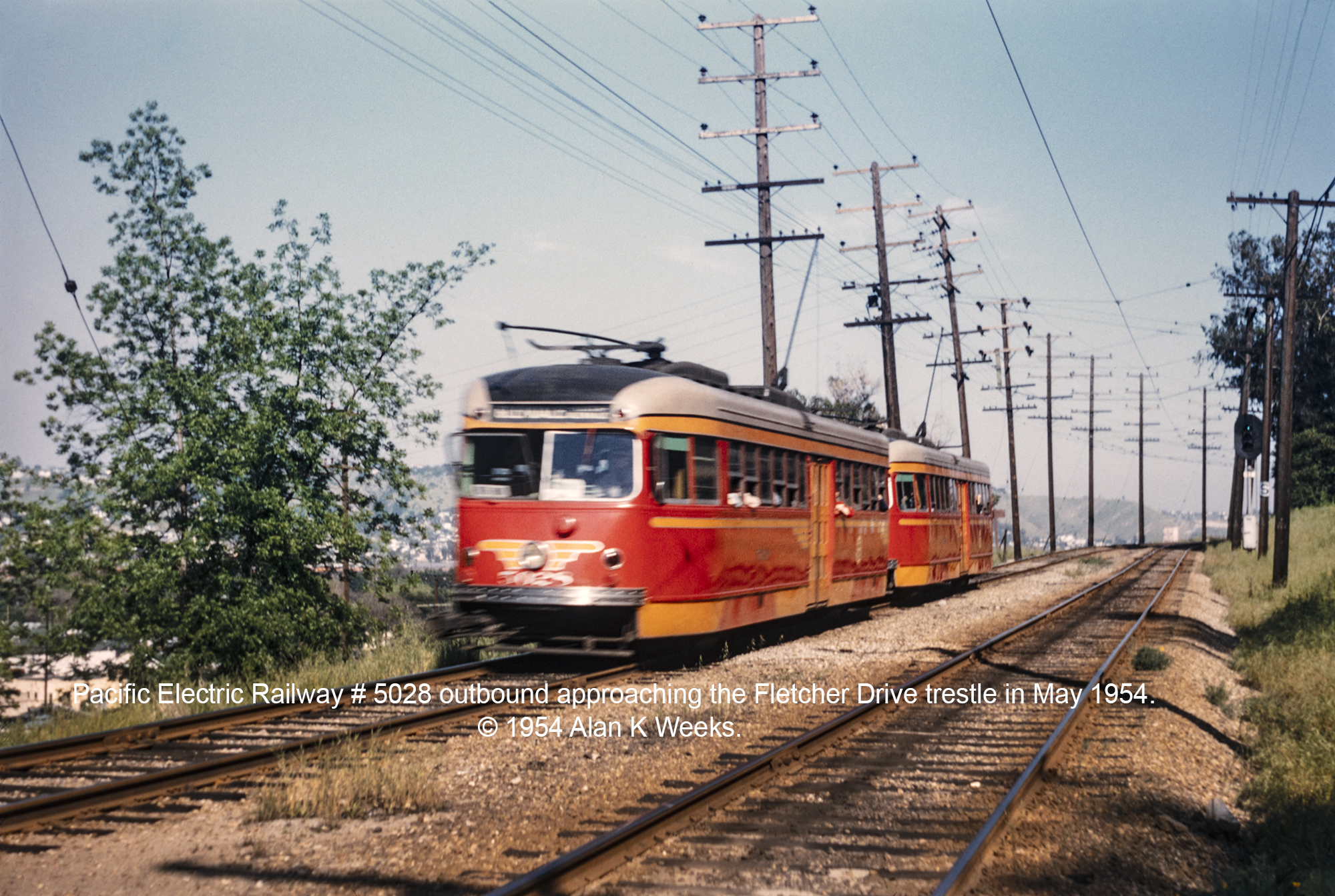 Pacific Electric Railway # 5028 outbound approaching the Fletcher Drive trestle in May 1954. © 1954 Alan K. Weeks.